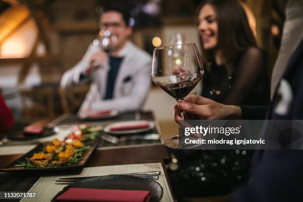 glass of red wine - wine dinner stock pictures, royalty-free photos & images