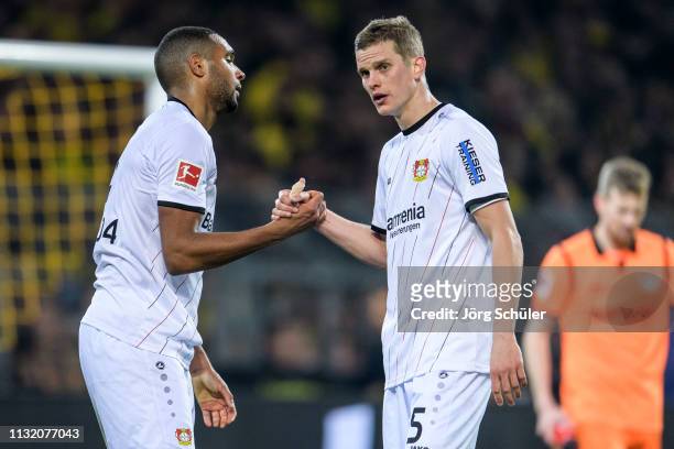 Jonathan Tah and Sven Bender of Bayer Leverkusen react after Leverkusen's loss during the Bundesliga match between Borussia Dortmund and Bayer 04...