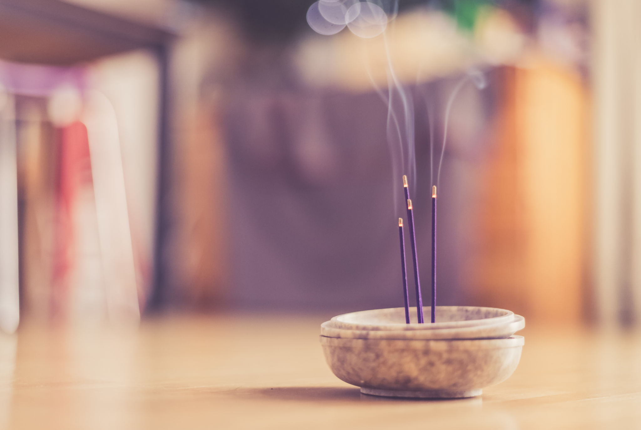 Smoking and smelling joss sticks at home, feng shui; Copy space Smoking and smelling joss sticks at home, feng shui; Copy space