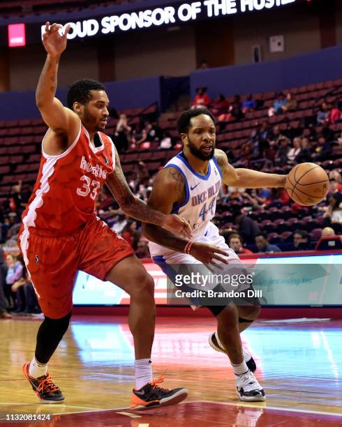 Dez Wells of the Oklahoma City Blue handles the ball against LaQuinton Ross of the Memphis Hustle at Landers Center in an NBA G-League game on March...