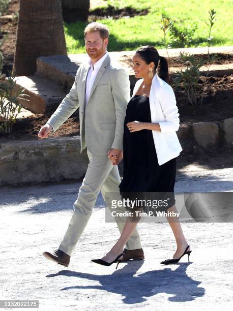 Prince Harry, Duke of Sussex and Meghan, Duchess of Sussex walk through the walled public Andalusian Gardens which has exotic plants, flowers and...