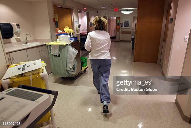 Nurse Robin McLaughlin runs to respond to a code red alarm for a patient during her shift at the Clinic Center at Beth Israel Deaconess Medical...
