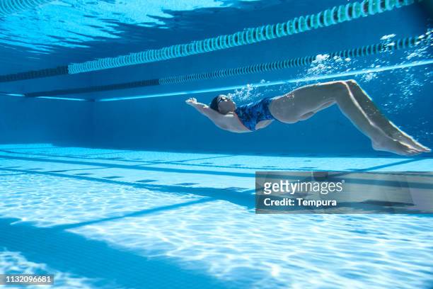 adaptive athlete training in the swimming pool. - backstroke stock pictures, royalty-free photos & images