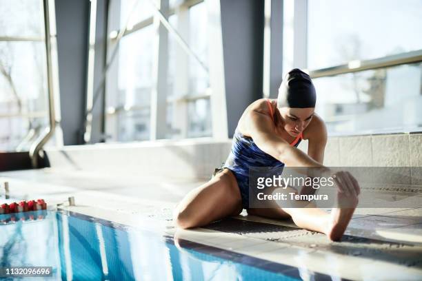 Adaptive Athlete warming up in the swimming pool.