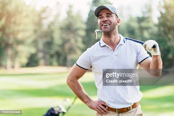 smiling golfer - male golfer stock pictures, royalty-free photos & images