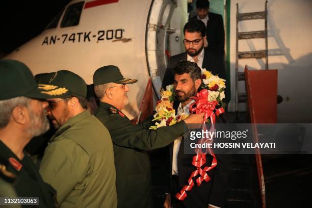 Brigadier-General Mohammad Pakpour , commander of the Islamic Revolutionary Guard Corps ground forces, welcomes four freed Iranian border guards who...
