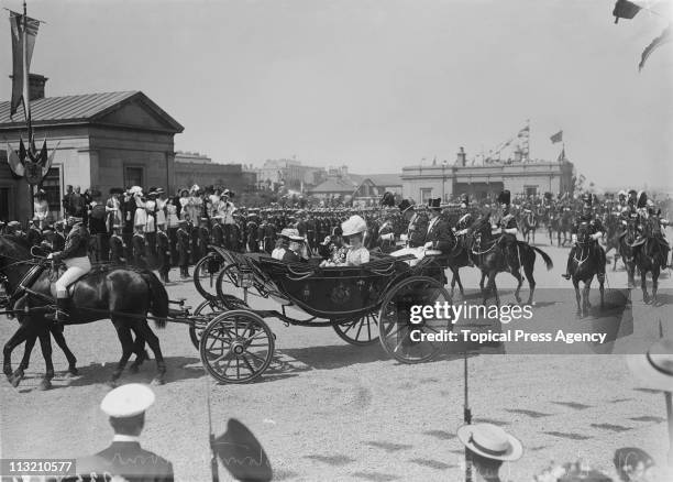 King George V and Queen Mary arrive at Kingstown, later Dun Laoghaire near Dublin, during a visit to Ireland, July 1911. They are accompanied by the...