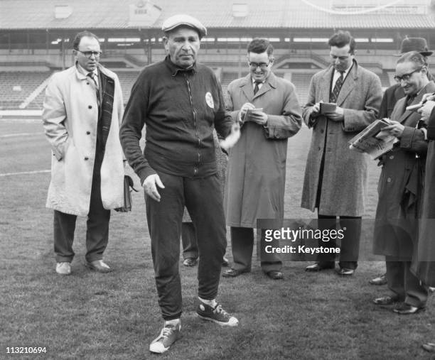 Benfica coach and manager Bela Guttmann with a group of journalists at White City in London, 4th April 1962. He had just accused Tottenham Hotspur of...