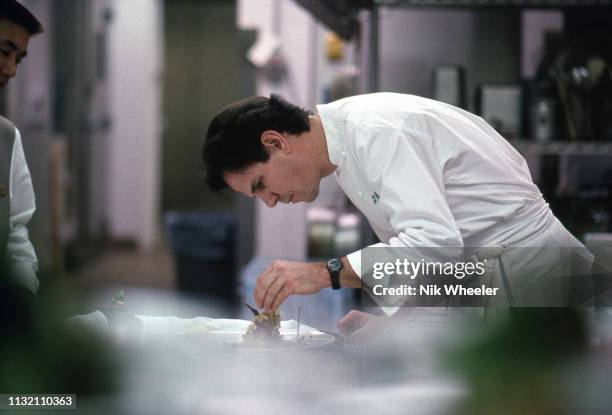 Master Chef Thomas Keller cooks in kitchen of his restaurant in hotel in Los Angeles circa 1996.