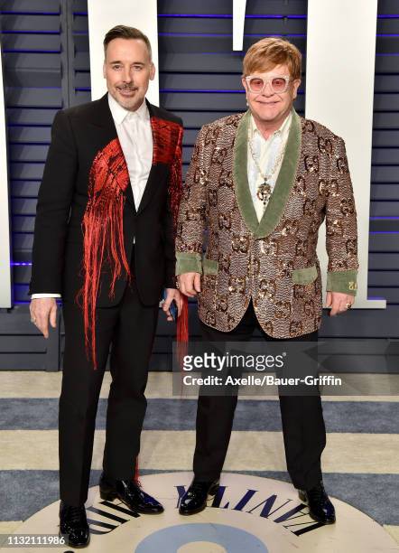 David Furnish and Elton John attend the 2019 Vanity Fair Oscar Party Hosted By Radhika Jones at Wallis Annenberg Center for the Performing Arts on...