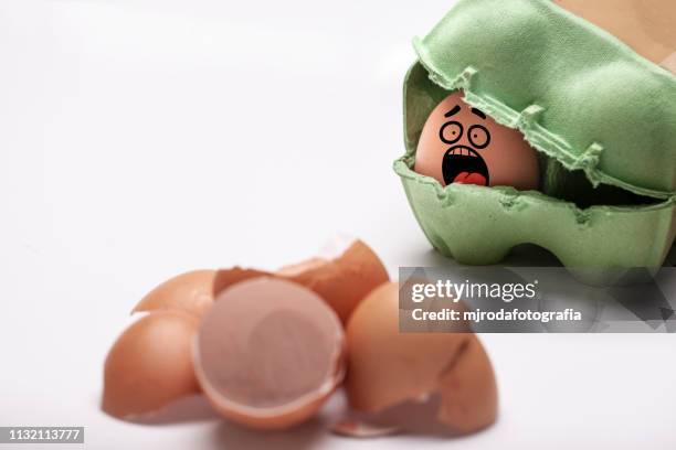 scared eggs waiting to be cooked - ingrediente stock pictures, royalty-free photos & images