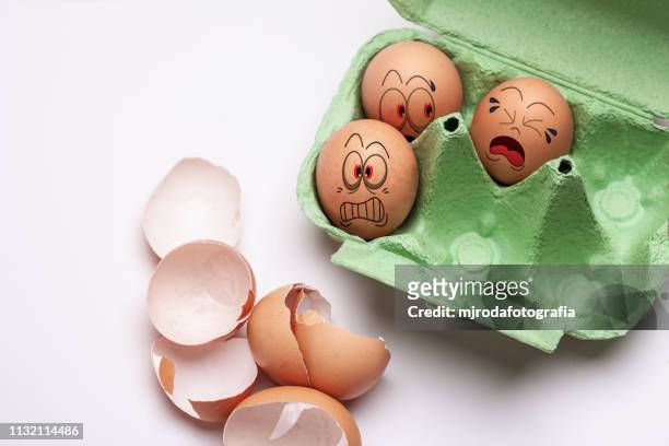 scared eggs waiting to be cooked - imaginación bildbanksfoton och bilder