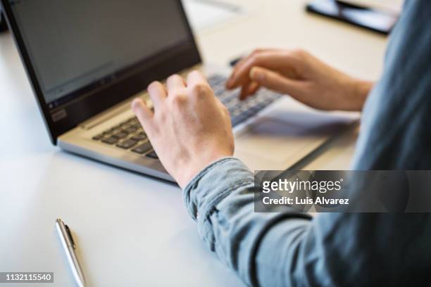close up of businesswoman working on laptop - laptop stock-fotos und bilder