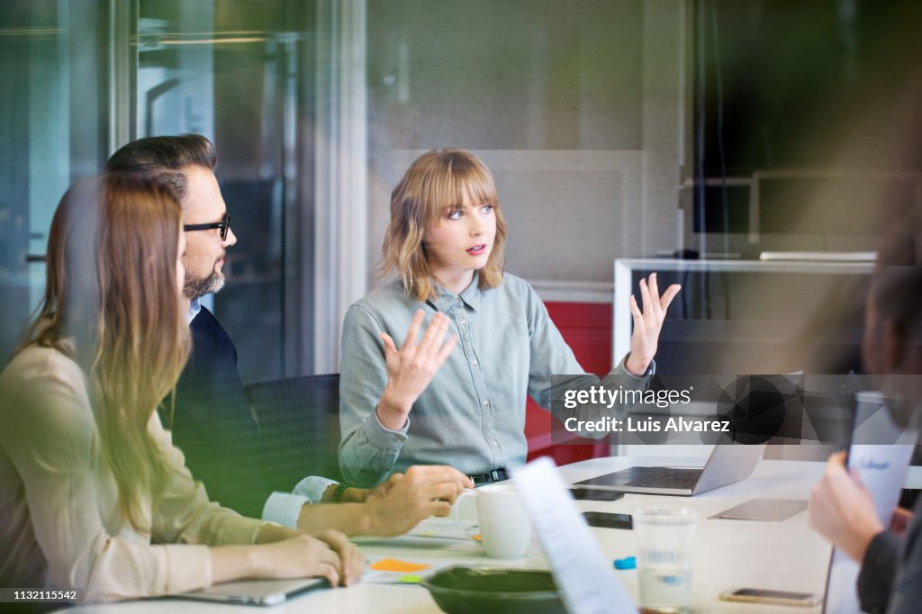 Team of professionals discussing in office