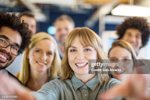 multi-ethnic business team taking a selfie - blonde woman selfie foto e immagini stock