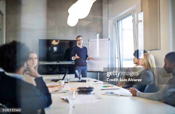 group of people during a presentation in modern office - growth strategy stock pictures, royalty-free photos & images