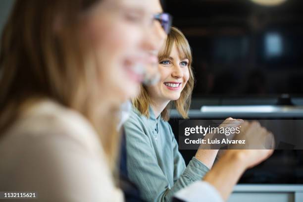 female professional in meeting - differential focus stockfoto's en -beelden