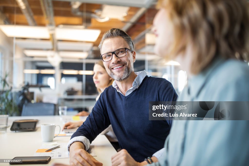 Male professional in board room meeting