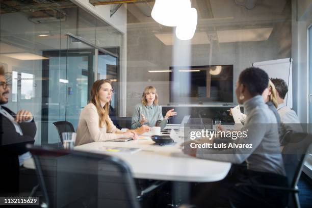 multiracial group of professionals having meeting - internal communication stock pictures, royalty-free photos & images