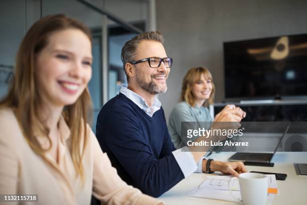 group of professionals working together in office - selective focus stock-fotos und bilder