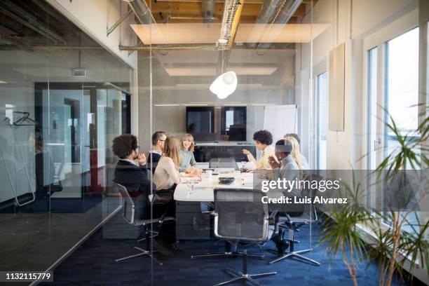 business people having board meeting in modern office - organised group fotografías e imágenes de stock