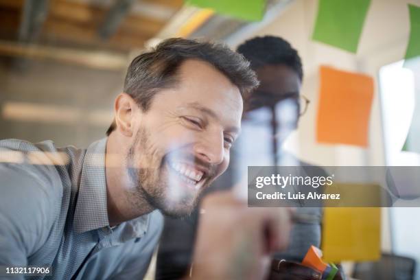 professionals planning together in office - ideas wall stock pictures, royalty-free photos & images