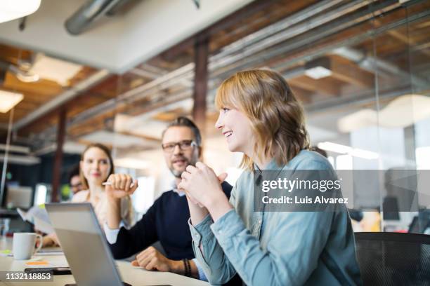 group of business professionals in meeting - blue shirt stock pictures, royalty-free photos & images