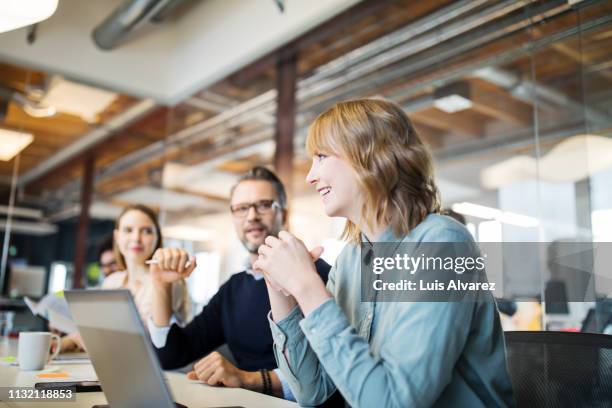 group of business professionals in meeting - business meeting three people stock pictures, royalty-free photos & images