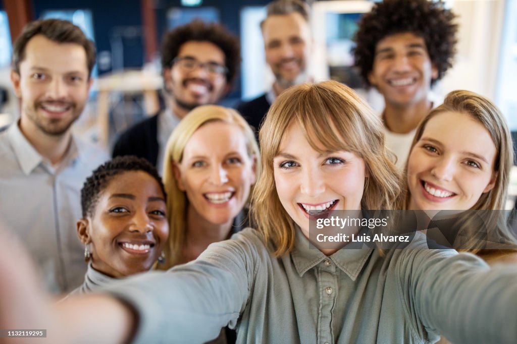 Successful business team taking selfie