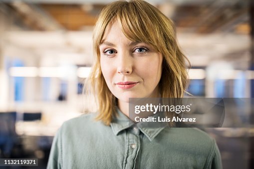 Portrait of young businesswoman in office Portrait of young businesswoman in office