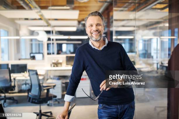 portrait of successful mid adult businessman - smart casual stock pictures, royalty-free photos & images