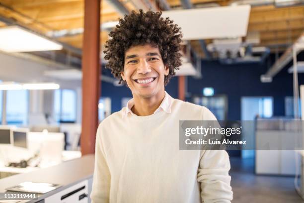 portrait of successful young businessman - man with curly hair stock pictures, royalty-free photos & images