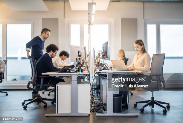 business people working in a small office - small office stock pictures, royalty-free photos & images