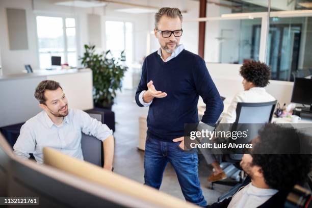 manager having meeting with colleagues - businessman hands in pockets stock pictures, royalty-free photos & images