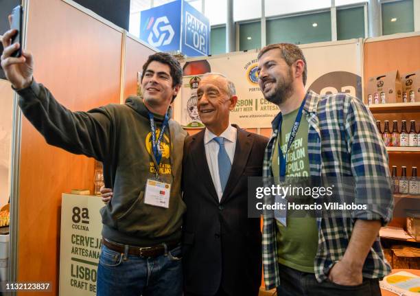 Portuguese President Marcelo Rebelo de Sousa poses for a selfie with staffers of "8a Colina Cerveja Artesanal" stand at SISAB Portugal 2019 in Altice...