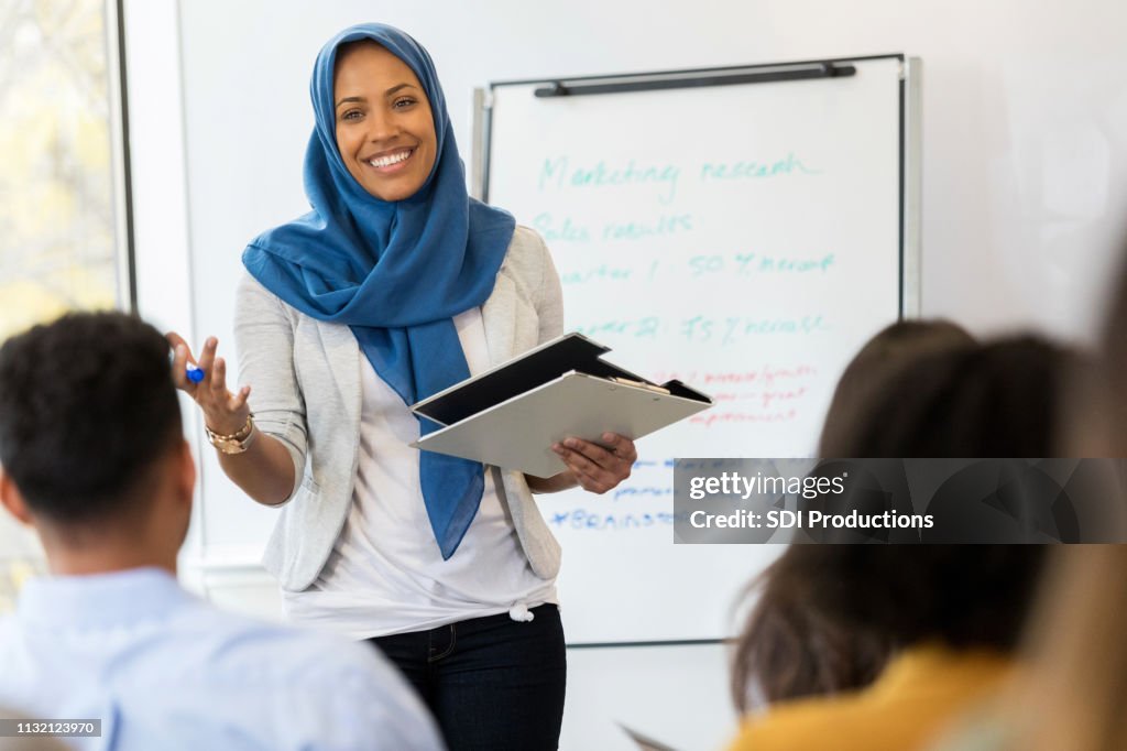 Businesswoman conducts employee training class