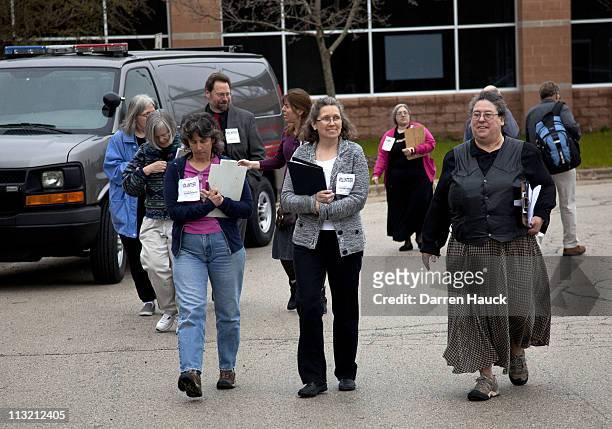 Volunteers for the Kloppenburg campaign arrive before members of the Milwaukee County Election Commission hand recount the ballots for the Wisconsin...