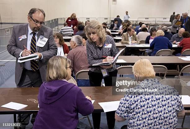 Members of the Milwaukee County Election Commission recount the ballots for the Wisconsin Supreme Court race between incumbent Justice David Prosser...