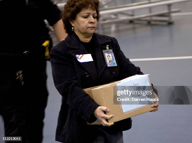 Absentee ballots are brought in as members of the Milwaukee County Election Commission recount the ballots for the Wisconsin Supreme Court race...