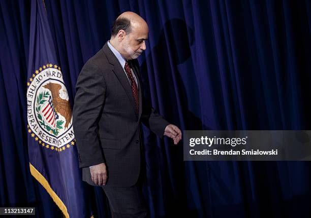 Federal Reserve Chairman Ben Bernanke leaves after his first news briefing at the Federal Reserve's Board of Governors building April 27, 2011 in...