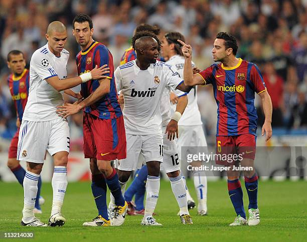 Xavi Hernandez of Barcelona argues with others during the UEFA Champions League Semi Final first leg match between Real Madrid and Barcelona at the...