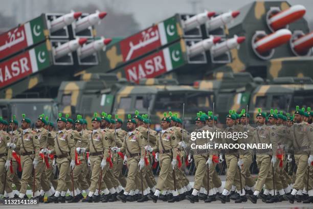 Pakistan troops march during the Pakistan Day parade in Islamabad on March 23, 2019. - Pakistan National Day commemorates the passing of the Lahore...