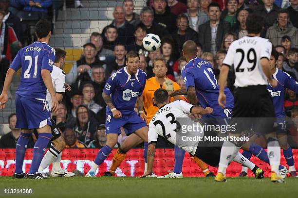 Clint Dempsey of Fulham scores the first goal during the Barclays Premier League match between Fulham and Bolton Wanderers at Craven Cottage on April...