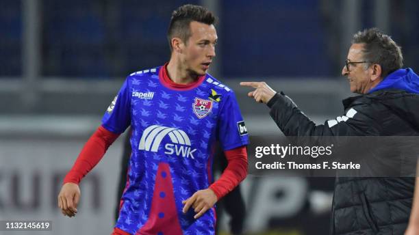 Head coach Norbert Meier of Uerdingen gives advice to Adam Matuschyk of Uerdingen during the 3. Liga match between KFC Uerdingen 05 and SC Preussen...