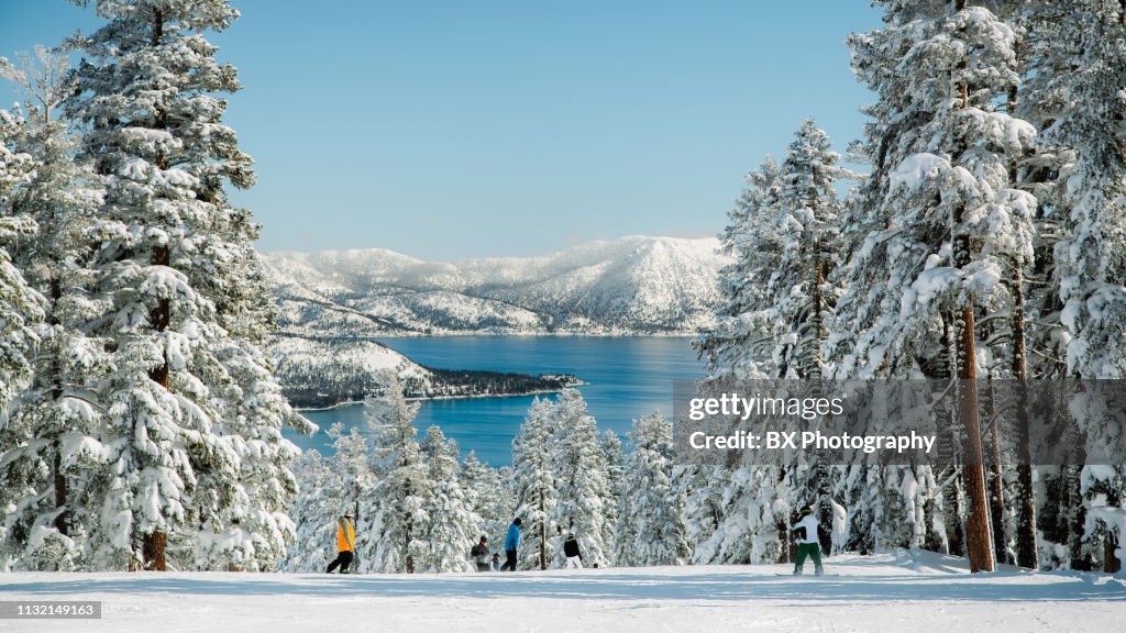 Mountain skiing with lake view