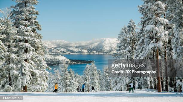 mountain skiing with lake view - nevada stockfoto's en -beelden