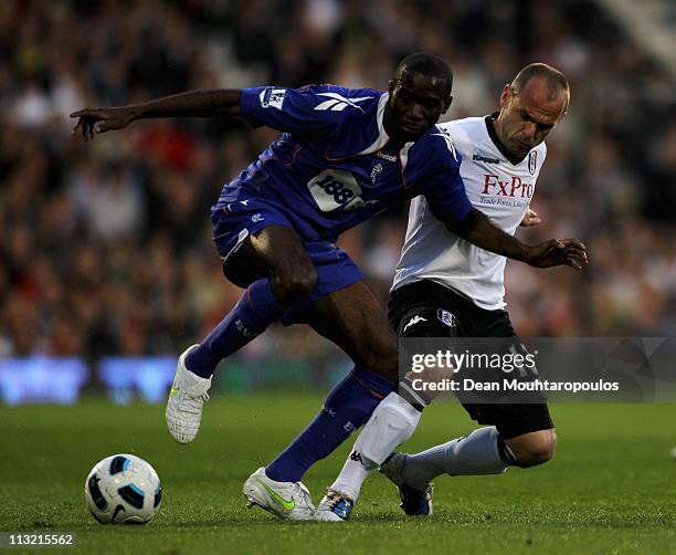 Danny Murphy of Fulham and Fabrice Muamba of Bolton battle for the ball during the Barclays Premier League match between Fulham and Bolton Wanderers...