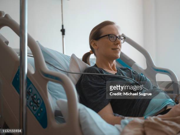 Pregnant woman in hospital bed.