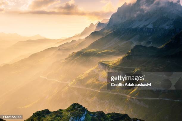 sunset over klausen pass, uri, switzerland - mountain pass stock pictures, royalty-free photos & images