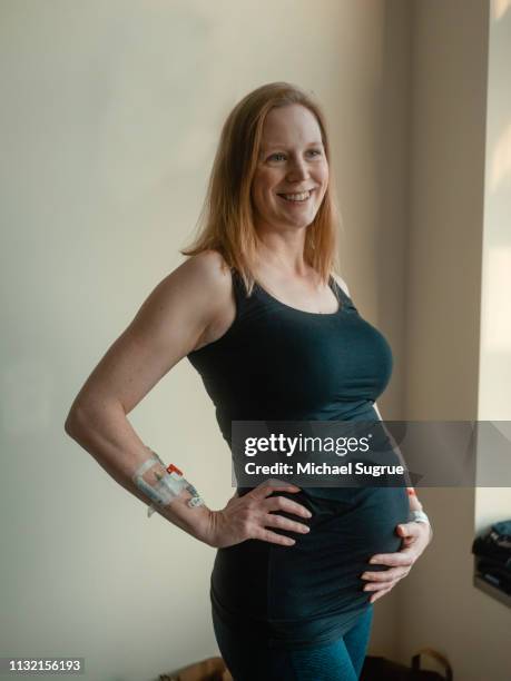 Pregnant woman in hospital bed.